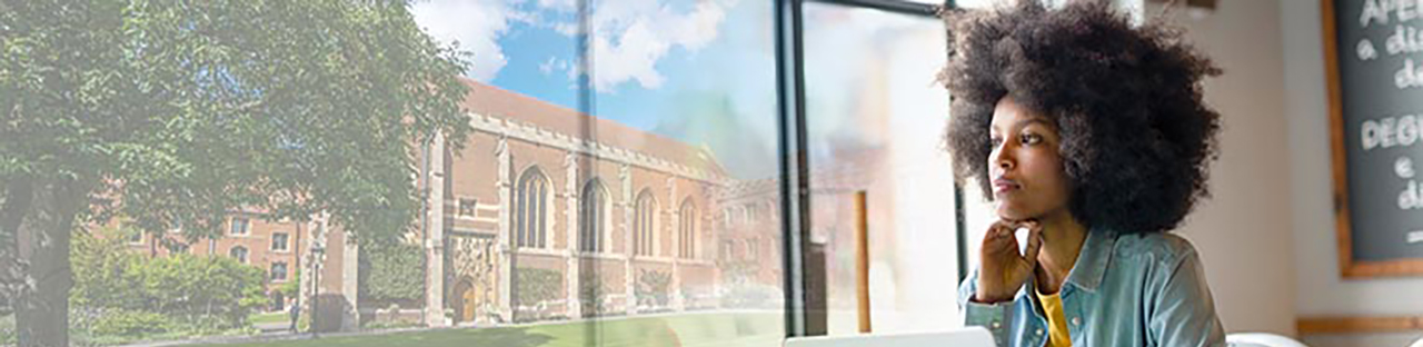 Woman looking out window at school building